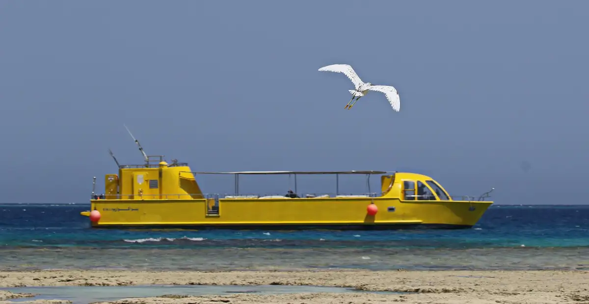 Yellow glass-bottom boat on the Red Sea