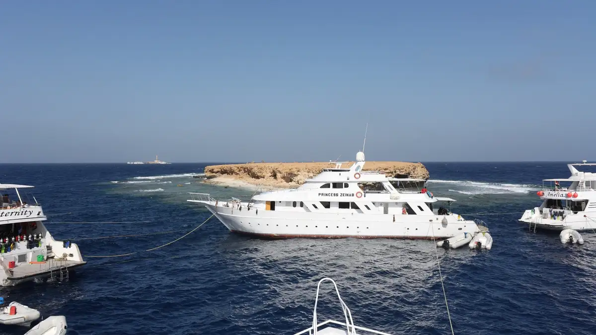 Boats moored near an island in the Red Sea